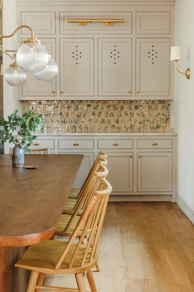 a kitchen with a table and chairs