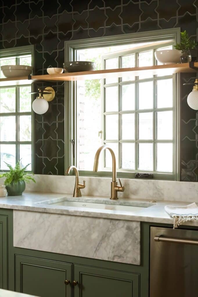a kitchen with a sink and windows